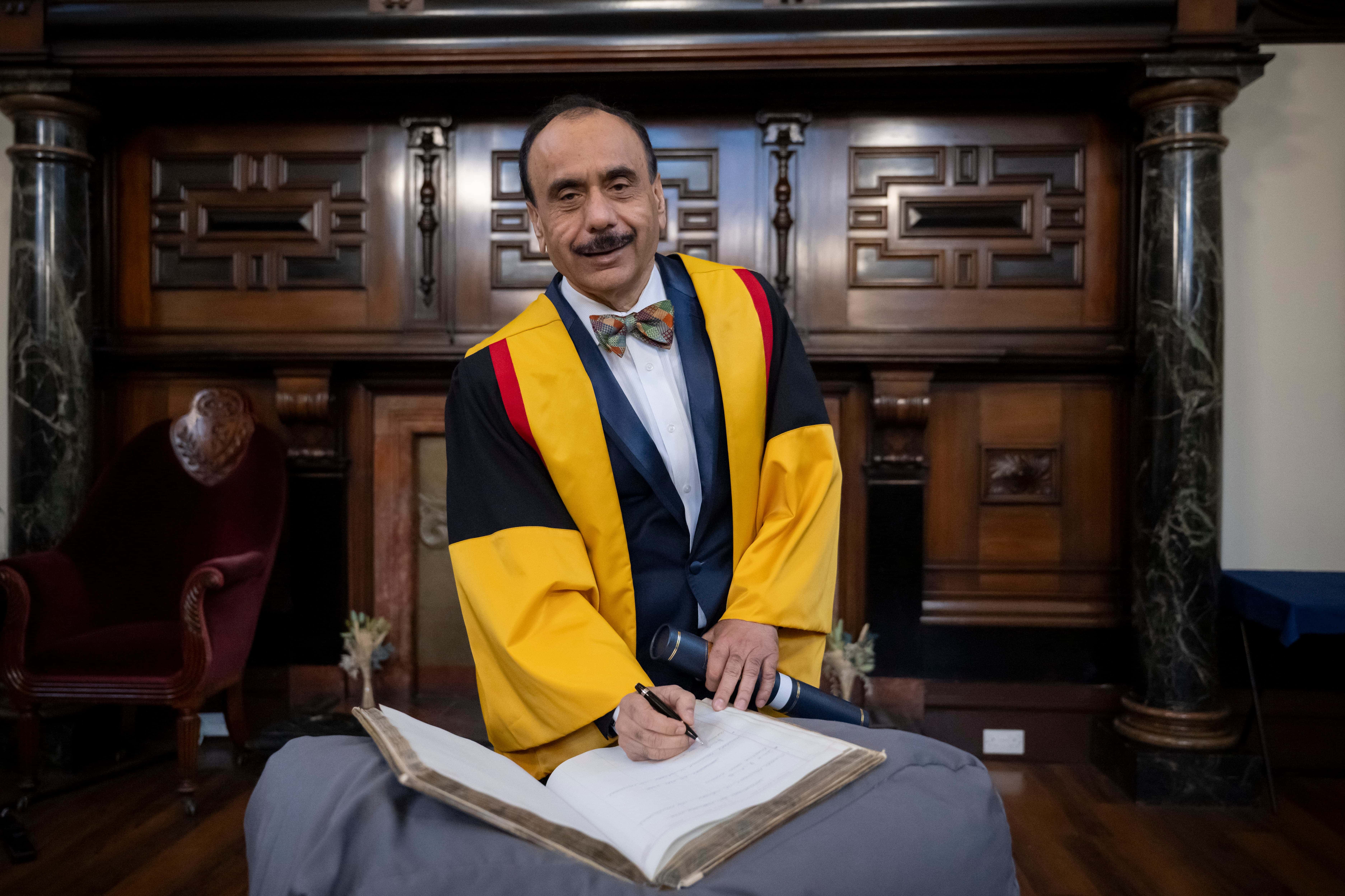 Professor Tewari signs Honorary Fellowship book
